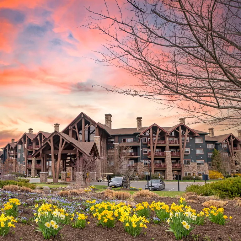 Grand Cascades Lodge exterior with beautiful sunset