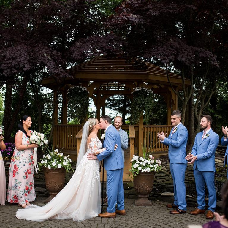 Bride and Groom kissing.