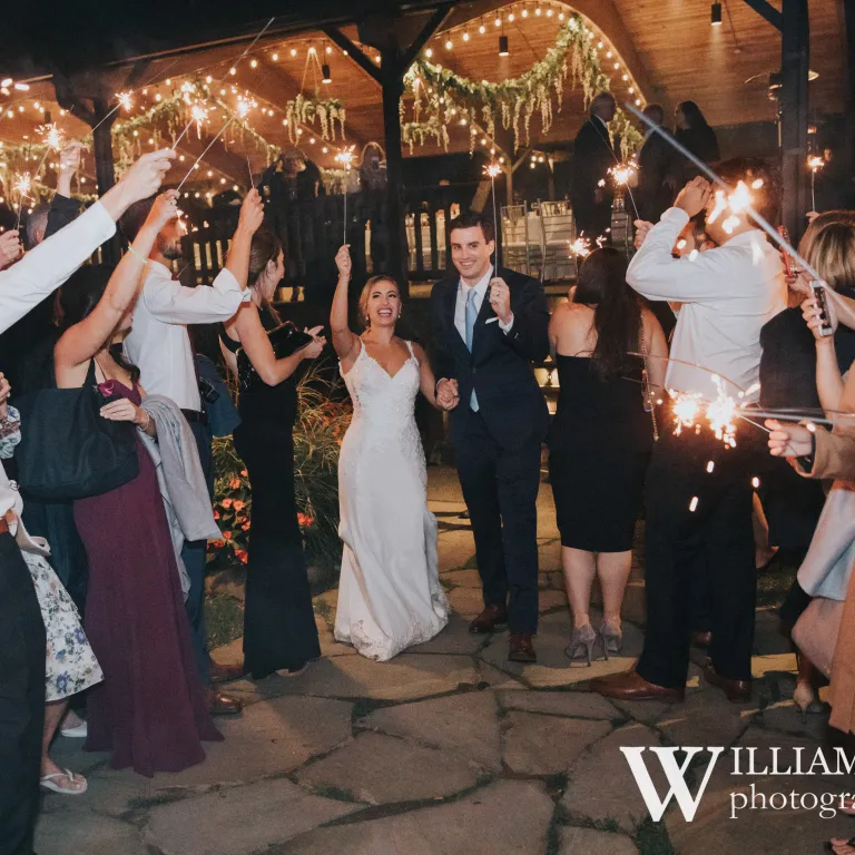 Wedding couple walking through sparklers