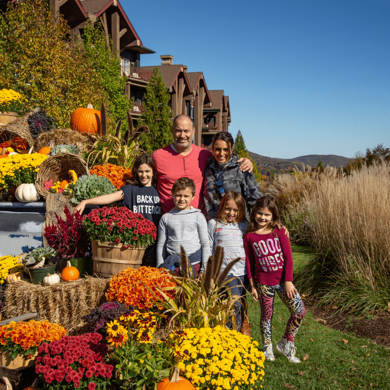 Fall family celebrating Thanksgiving at Grand Cascades Lodge