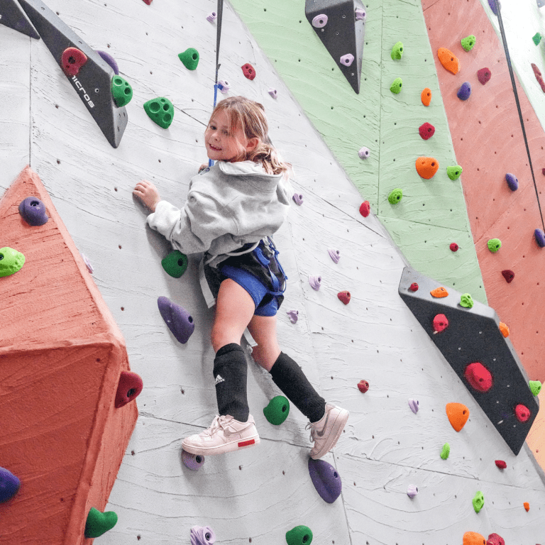 Child rock climbing.