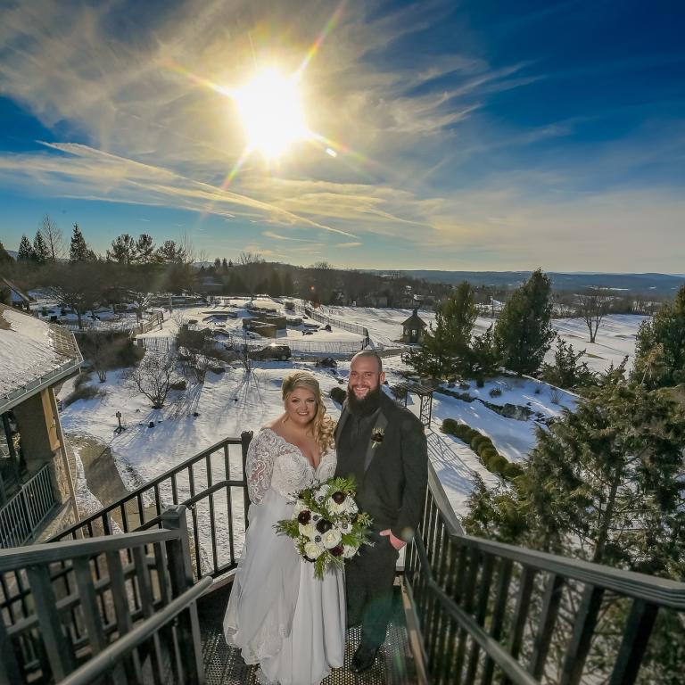 Bride and Groom from a winter wedding with a view of the valley from the Crystal Springs Clubhouse.