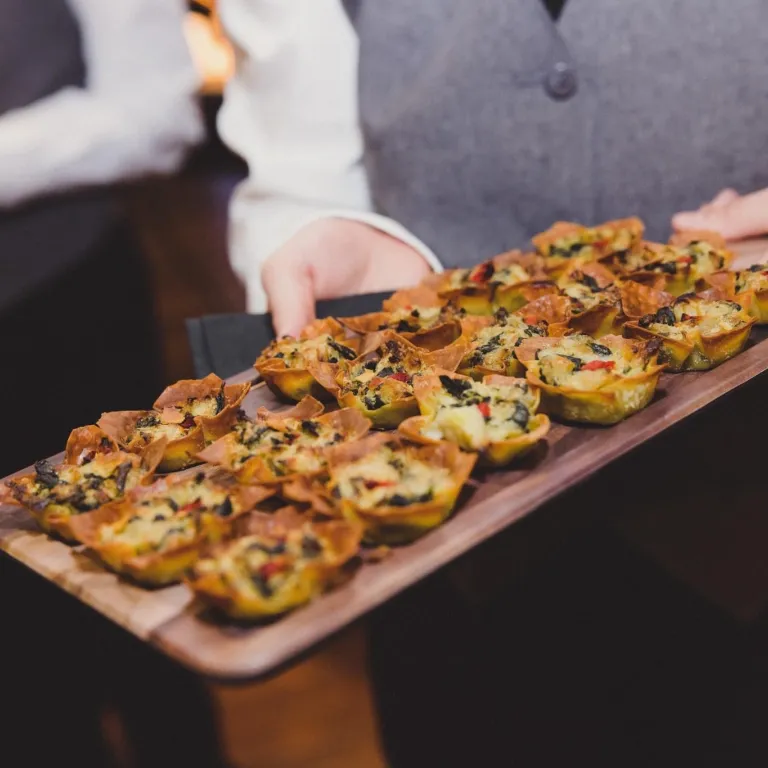 Waiter holding Hors d'oeuvres platter