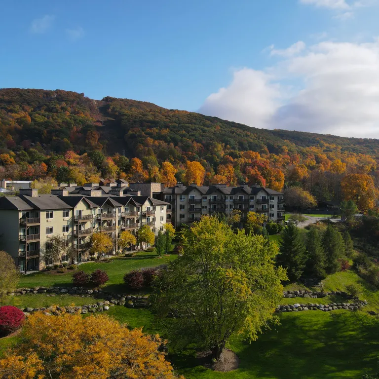 Minerals Hotel sits in front of fall mountain range.