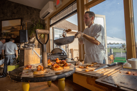 Chef at Ballyown Hickoory &amp; Scotch Outing cooking fresh lobster crostini