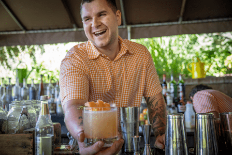 Bartender serving cocktails at Chef's Garden