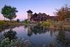 Pond view of Clubhouse at Sunset