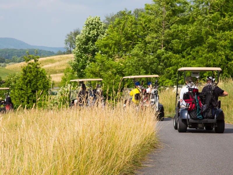 Golf carts driving to their next hole at Cascades Golf Course at Crystal Springs Resort