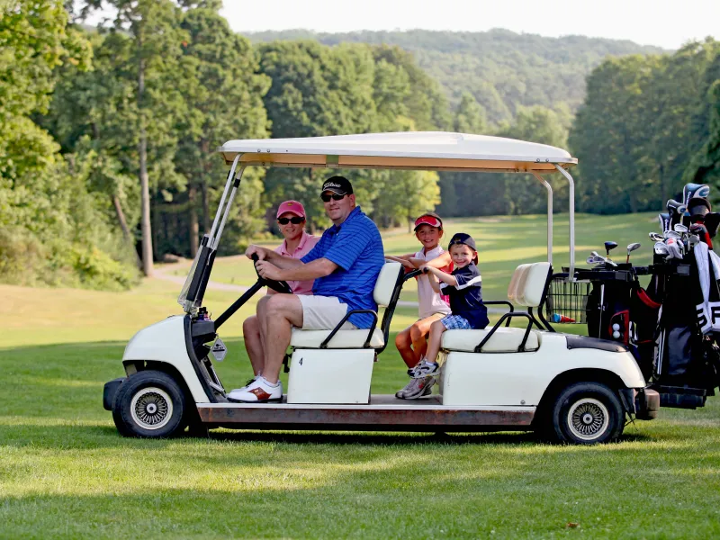 Parents with their kids on a family friendly golf course at Crystal Springs Resort in New Jersey.