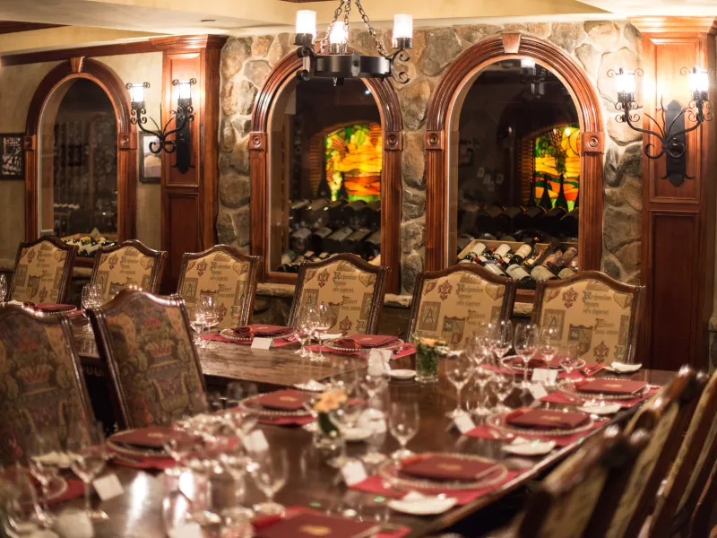 Wine Cellar Bordeaux Room set up long wooden dinner tables.