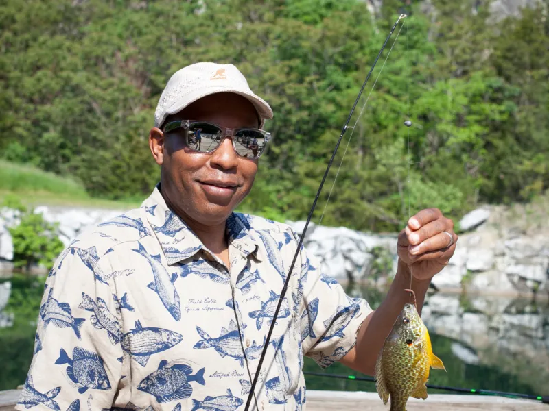 Man holding fish at the quarry