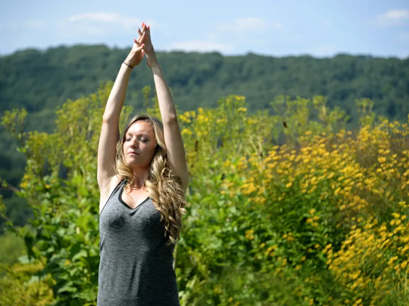 Woman doing Yoga Pose Outdoors