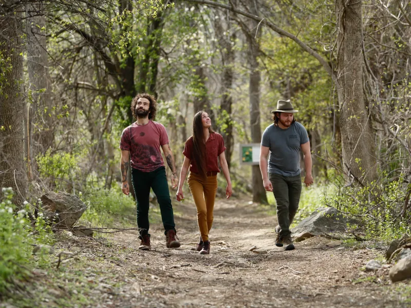 Three people hiking at Wild Turkey Nature Trail