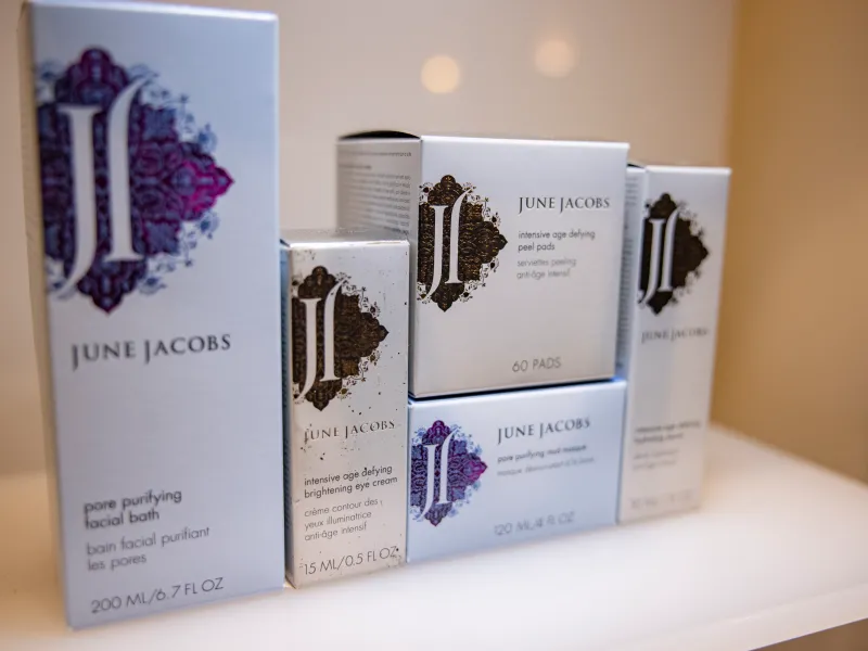 June Jacobs skincare products on Elements Spa shelves.