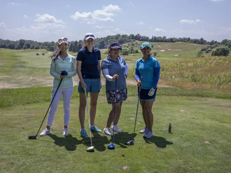 Group of women on a golf course at Crystal Springs Resort