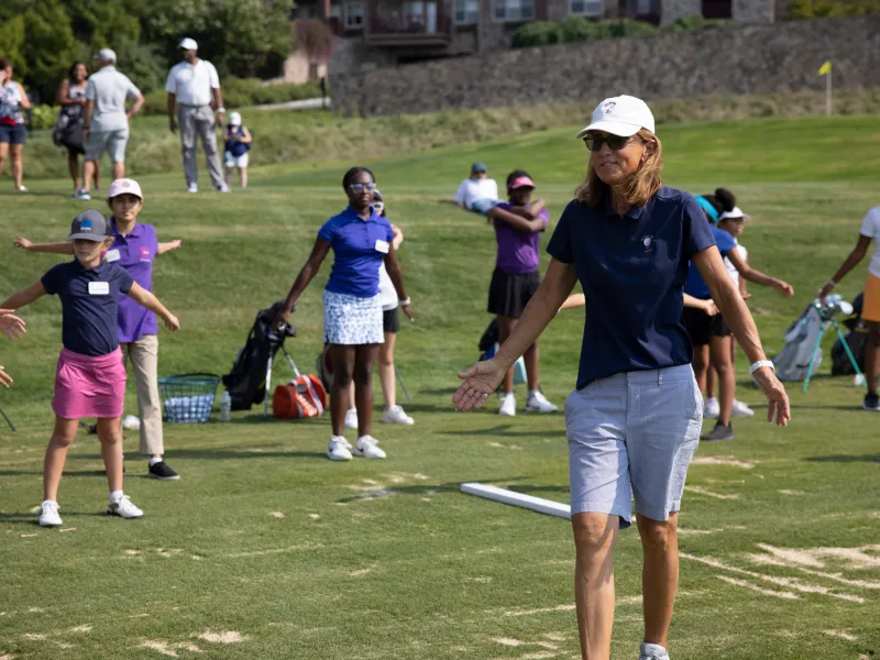 Golf instructor teaching young girls to golf at Crystal Springs Resort